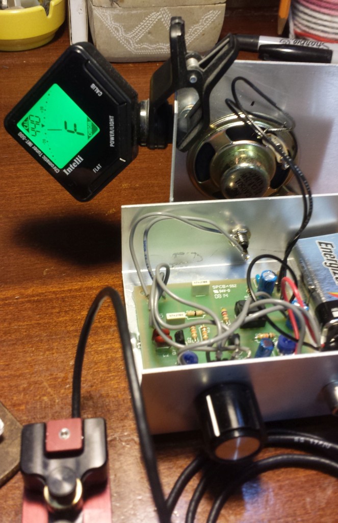 Guitar tuner clamped onto the lid of the code practice oscillator