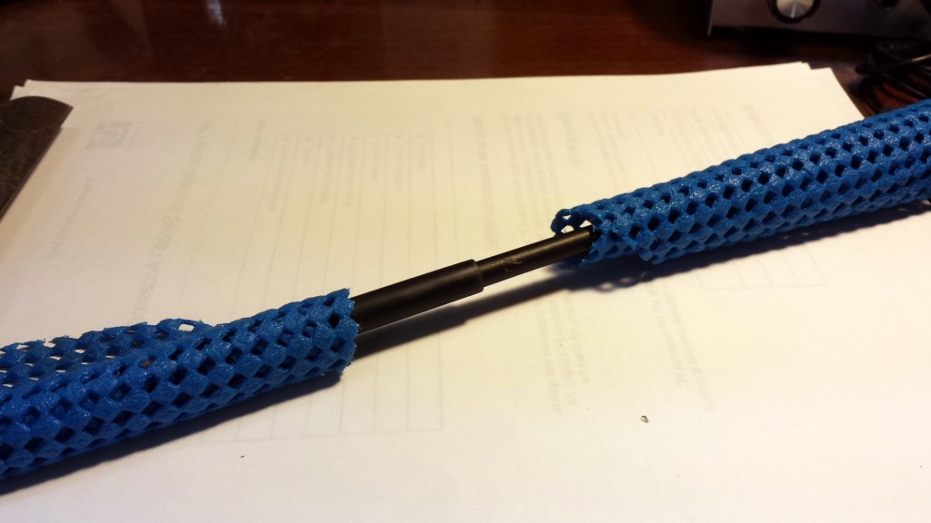 When wrapped around the two stuck sections of a pole as shown, these jar lid grippers help you twist the sections to get them apart.