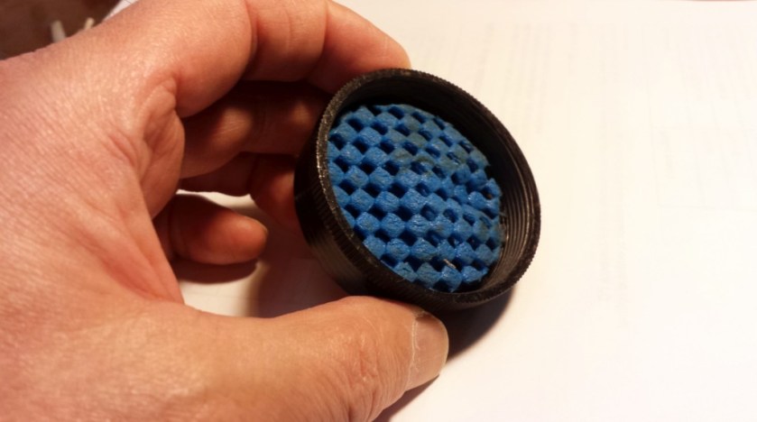This is two layers of material cut from the dollar store lid gripping pads placed inside the bottom cap of a Jackite 31-foot pole. The intent is to absorb some of the impact when collapsing the pole.