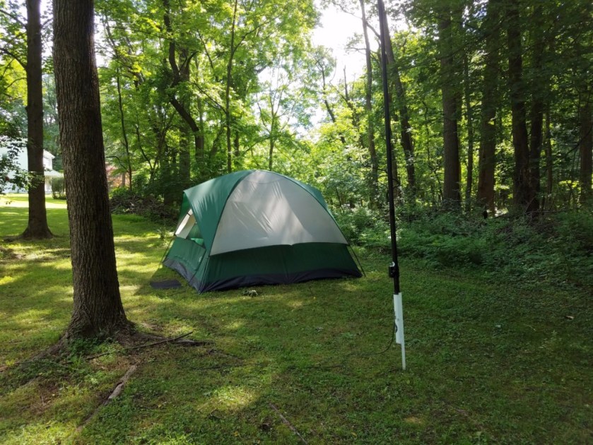 This is my (WB3GCK) tent. The Jackite pole in the foreground is supporting the vertical portion of my 58-ft inverted L antenna.
