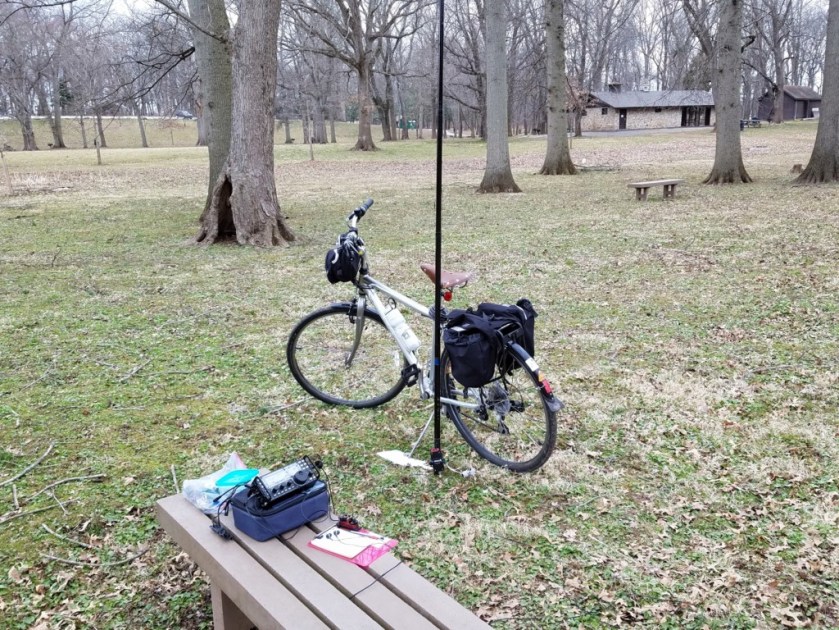 My setup in Lower Perkiomen Valley Park. The white object on the ground is a Dollar Store cutting board. The ground was soft so I used the cutting board under the kick stand to stabilize the bike.