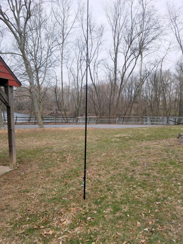My antenna today. My $9 telescopic pole from eBay is mounted on a screwdriver shoved in the ground.