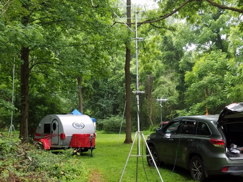 Part of the W3BQC Field Day site. Some of the VHF/UHF antennas are in the foreground. You can see the satellite antenna array in the background (above the car's hood).