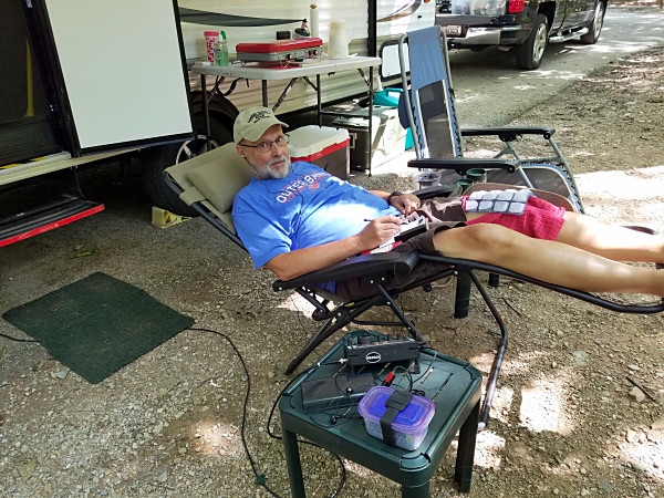 Icing my injured knee while making contacts.