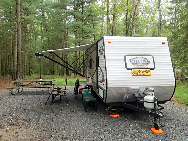 The WB3GCK QRP camper at Pine Grove Furnace State Park. If you look closely, you can see my antenna behind the picnic table. The white object is a plastic bag protecting the 9:1 unun from the rain we had on Friday night. The horizontal part of my inverted L runs back into the woods.
