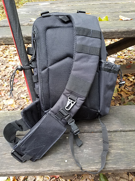 The back side of the Red Rock Rambler sling pack. There's a pouch behind the padded back of the pack that holds a folding sit pad. The small strap at the bottom of the picture helps to stabilize the pack but can be tucked away if not needed. My cell phone pouch is at the bottom of the shoulder strap.