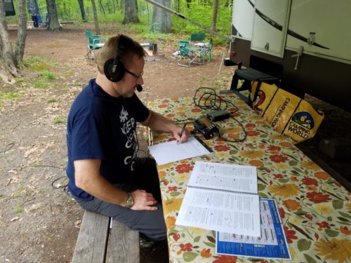 Ron WA8YIH operating outside his camper at French Creek State Park