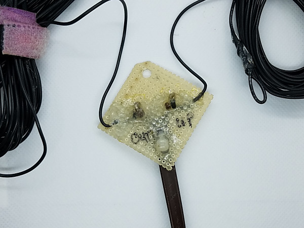 This is the center connector of the doublet that I use for my "Up and Outer" antenna. I used Amazing GOOP to seal the soldered connections and help anchor the wires in place. This particular antenna was built about 15 years ago and is still holding up well.