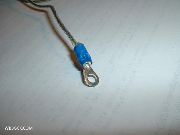 I used a ring terminal to terminate the 50-foot wire. Note that the terminal is crimped over the wire's insulation. The metal ring terminal is electrically-isolated from the antenna wire.