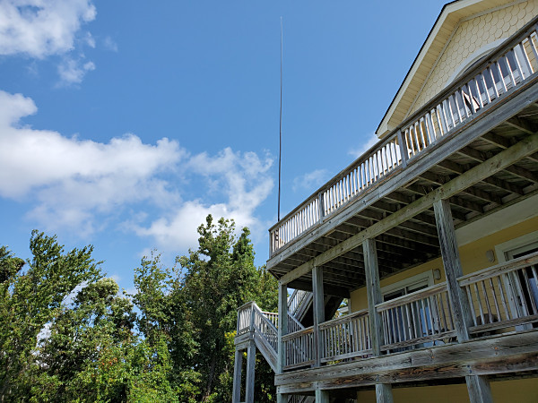 My 31-foot Jackite pole strapped to the railing on the 3rd story deck of the rental house. I operated from the deck below with a great view of Currituck Sound.