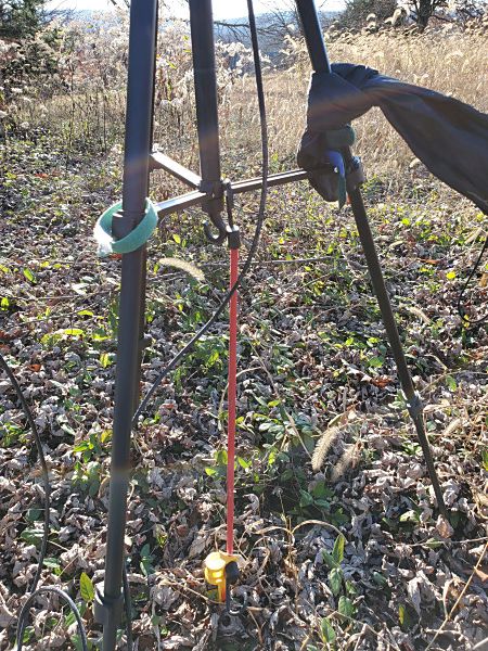 I had to rig up a tent stake and bungee cord to keep my antenna from blowing over.