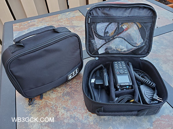 My HT "go bags." Several items were left out of the open bag, for the sake of clarity. I often pack a desktop charge, roll-up J-pole, a couple of spare batteries, and a hotspot for digital voice modes.