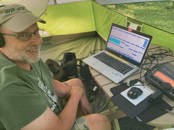 Yours truly operating CW from my tent (Photo credit: NK1N)