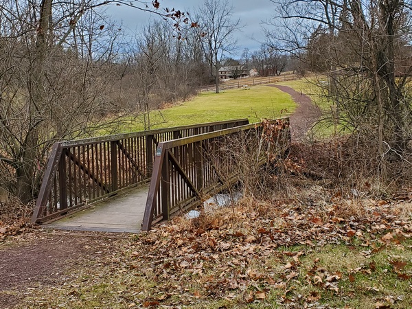 The bridge across the creek behind the lodge