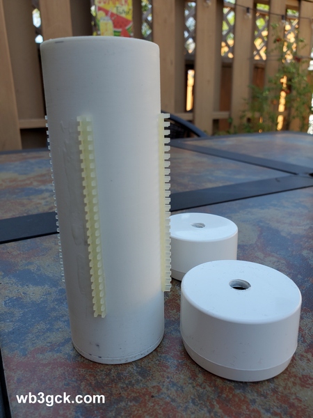 This is the coil form with the four strips of grommet edging glued on. The ends were drilled to accommodate the 3/8-24 bolts.