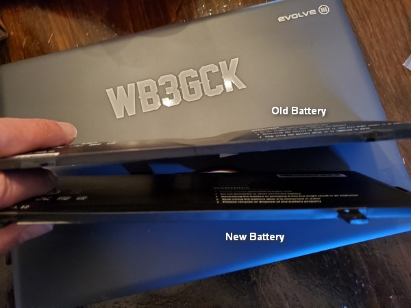 It's not a great a picture, but you can see how bloated the old battery was. In comparison, the new battery is perfectly flat.