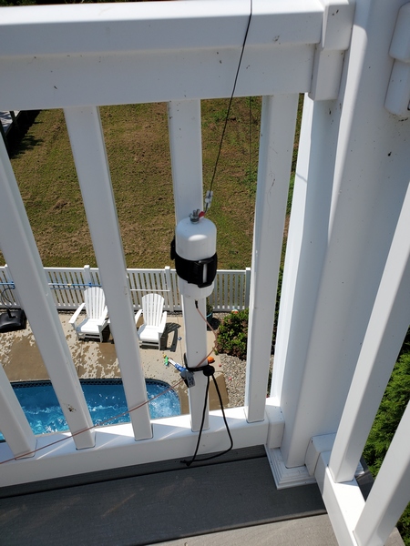 My antenna feedpoint. The far end of my random wire sloped down to the fence by the pool.