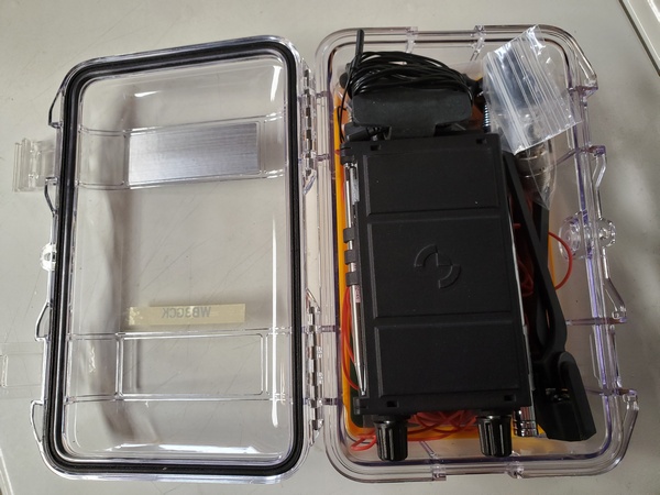 Pelican M50 MicroCase. The counterpoise wires and a notepad are under the KH1.