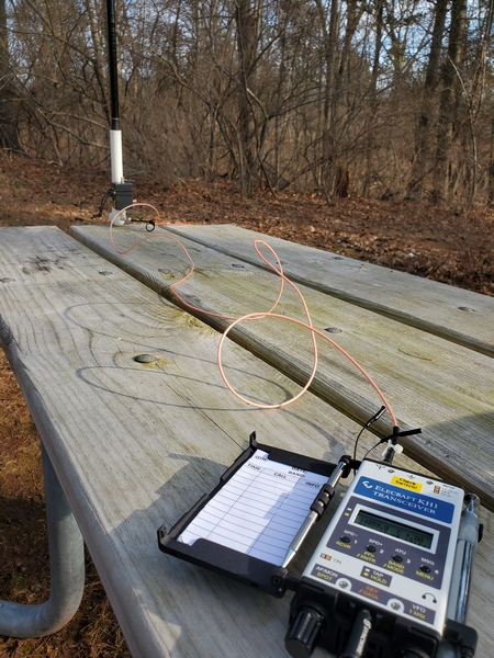 Typical picnic table setup with the 12-ft vertical and Elecraft KH1