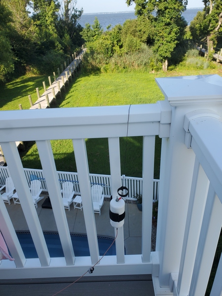 The feedpoint for my 35-foot end-fed wire. The far end of the antenna is attached to the fence below.